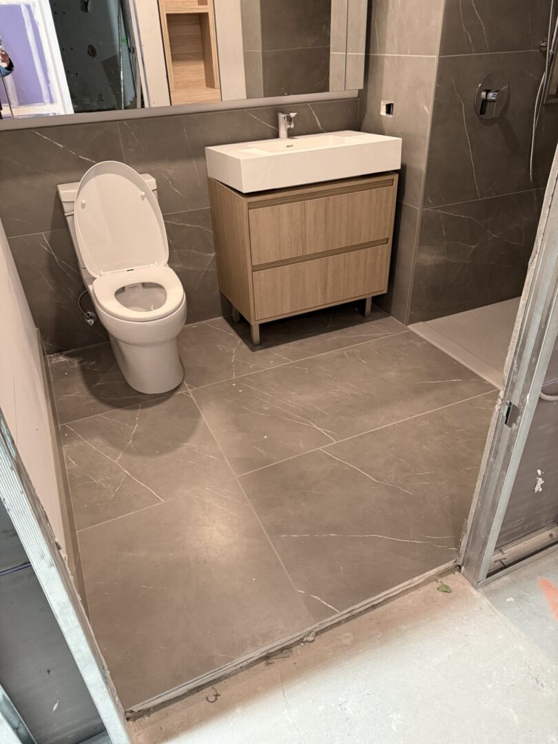 A bathroom with a toilet and sink in it
