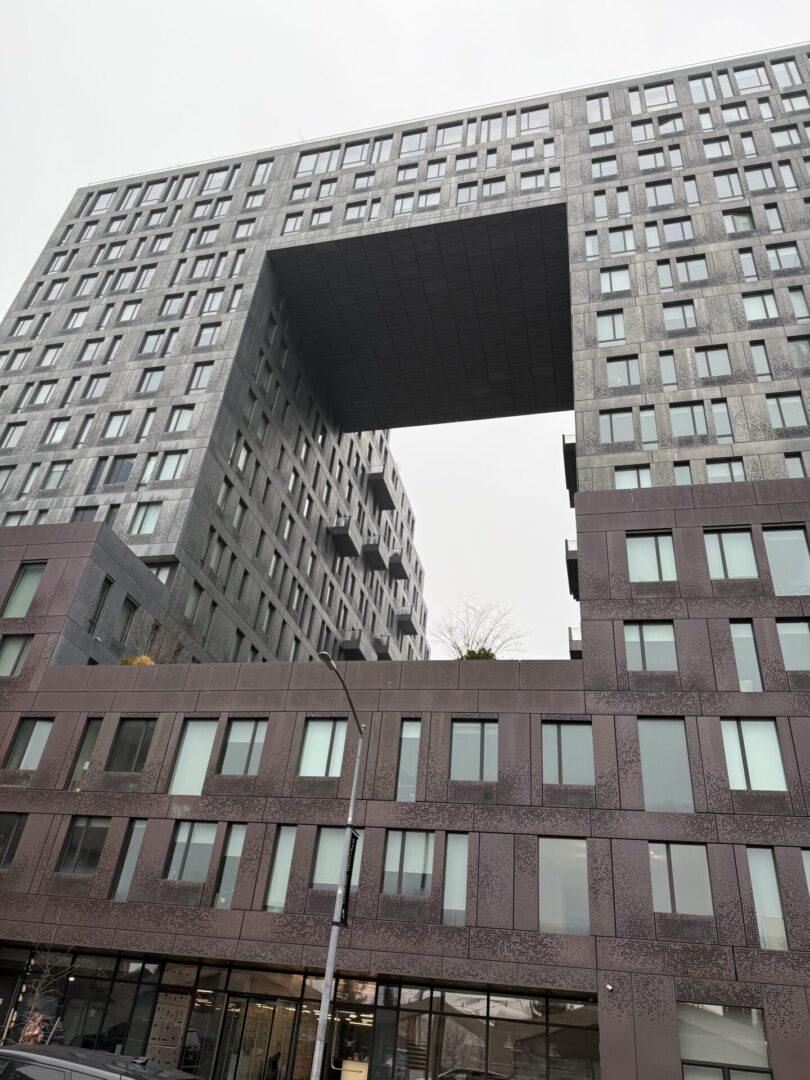 A building with an open window in the middle of it.